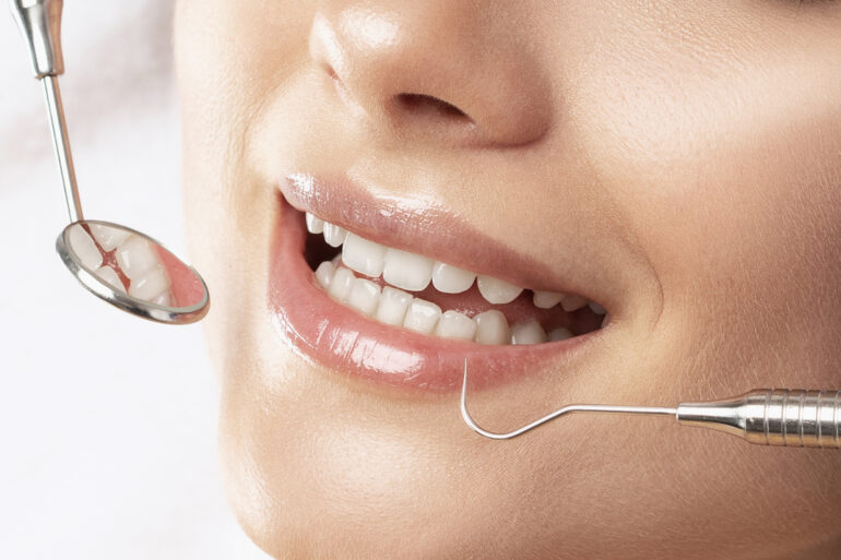 a woman in the dentist chair getting an examination